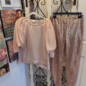 LIKE NEW. SOLD AS A SET WOMENS UMGEE PUFF SLEEVE BLOUSE WITH SEQUINED LEGGINGS.